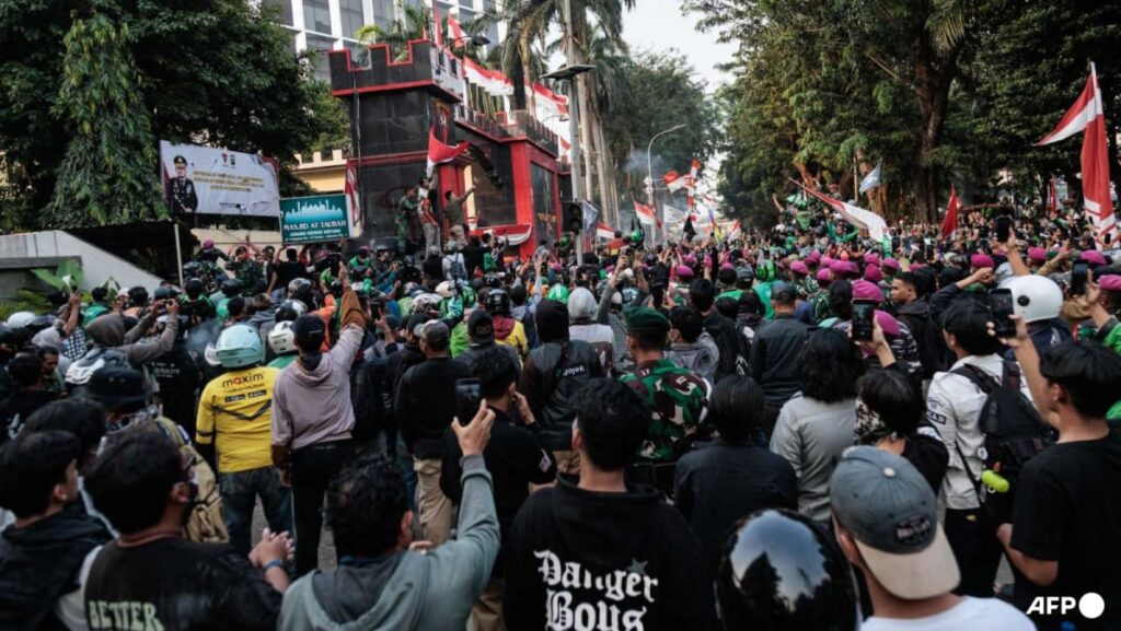 As it happened: Indonesian police fire tear gas at protesters in Jakarta after driver’s death